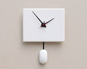 Clock created from a recycled Apple ibook laptop cover